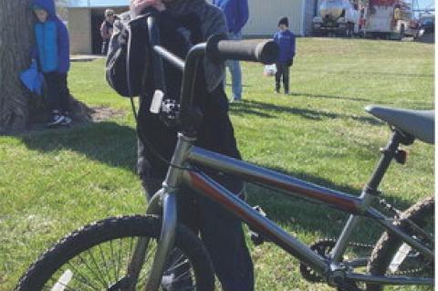 William Oorlog poses with the bike he won.