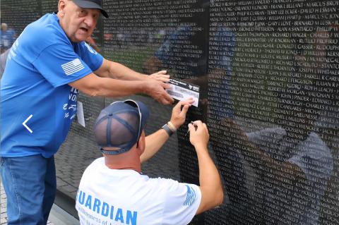 Fischer and his son, Dan Fischer, make an etching of the names Wendell W. Stewart and Gareth J. Deal, both natives of Wagner, who lost their lives in Vietnam while serving our country.