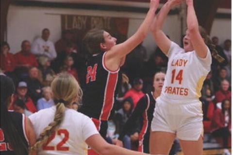 Alexis Vanderlei gets over the tough defense for the 2-point attempt as Kaeli Wallinga sets up to rebound. Photos by Barb Pechous