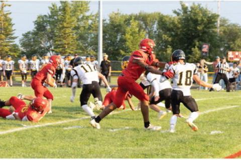 Al'Shamon Gunter sets up the block for Weston Bierema. Photos by Jenna Petrik