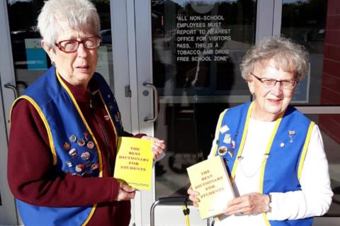 AUXILIARY DELIVERS DICTIONARIES FOR WAGNER 3RD GRADERS