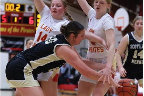 Alexis Vanderlei and Kaydence Metzger set up defensively, looking to disrupt the pass. Photos by Barb Pechous