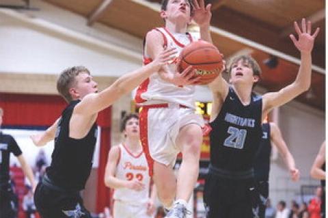 Zander Fathke drives through defense to add 2 points to the scoreboard.