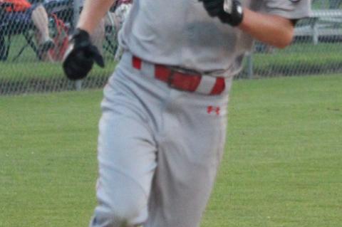 Connor Gabel comes across to score for the team.