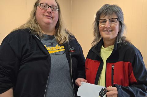 Wagner American Legion Auxiliary President Alyssa Mathis presents check to Arlis Kafka.