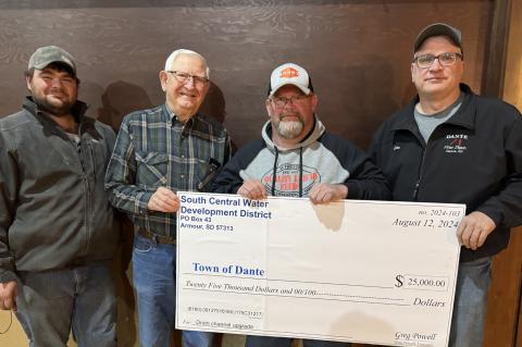 Rich Jones representing South Central Water Development District presented the Dante Town Board members with a check for $25,000 to assist with upgrades to Dante’s existing drainage channel. Pictured are, from left: Tyler Koupal, Dick Rysavy, Rich Jones