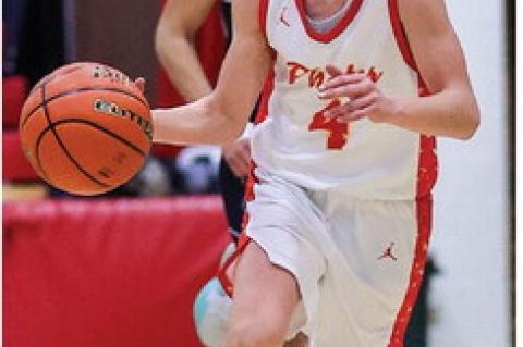 Zander Fathke brings the ball down the court.